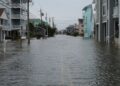 Coastal street flooding on Carolina Beach, NC during king tide.