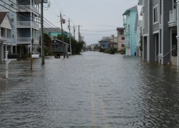 Coastal street flooding on Carolina Beach, NC during king tide.