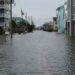 Coastal street flooding on Carolina Beach, NC during king tide.