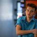 Model and actor Hondo Hendricks rolls up his shirt sleeves while hanging out at Wake Up Call coffeeshop in Blackfoot, Idaho on March 25, 2025.